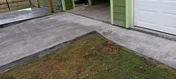 Beveled concrete down to a slight ramp for storage area